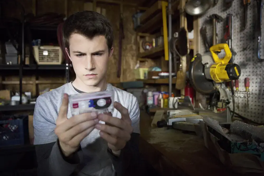 Dylan Minnette holding a tape in 13 Reasons Why.